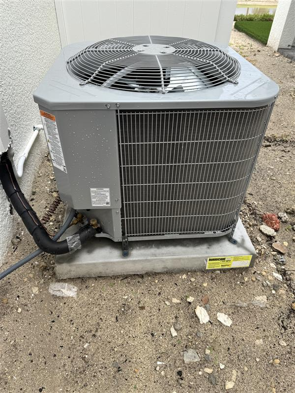 Condenser on hurricane-rated pad